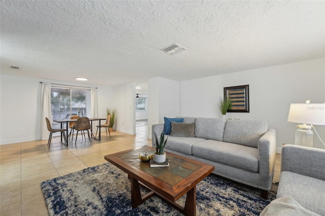 tiled living room with a textured ceiling