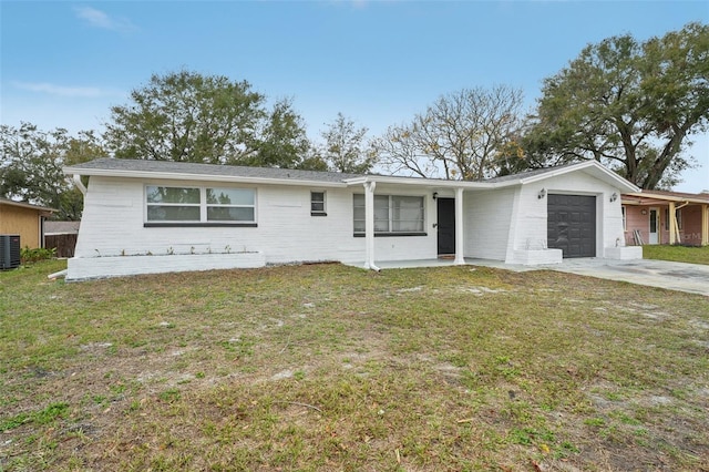 ranch-style house with a garage, central air condition unit, and a front lawn