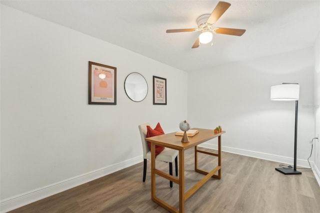 dining room with ceiling fan and light hardwood / wood-style floors