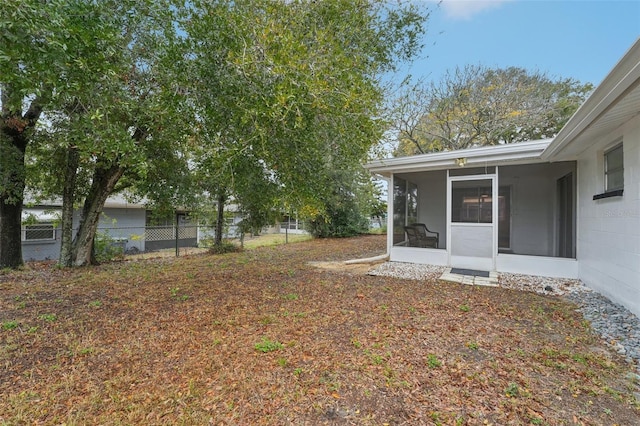 view of yard with a sunroom