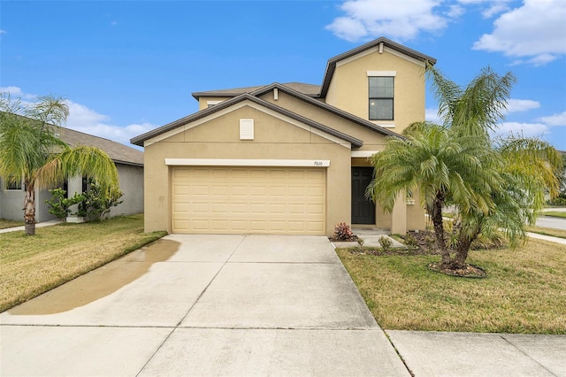 view of front of home with a front yard and a garage