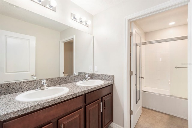 bathroom with vanity and shower / bath combination with glass door