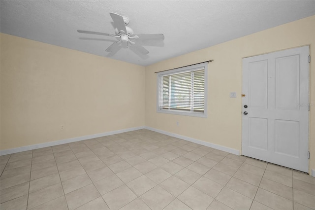 interior space with ceiling fan and a textured ceiling