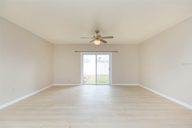 unfurnished room with ceiling fan and light wood-type flooring