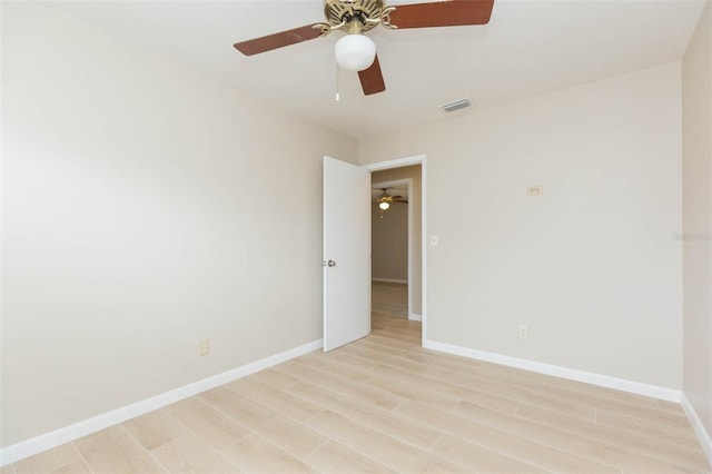 spare room with light wood-type flooring