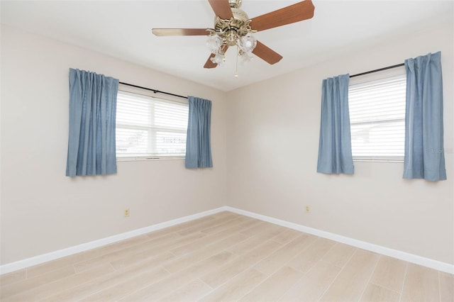 spare room with ceiling fan