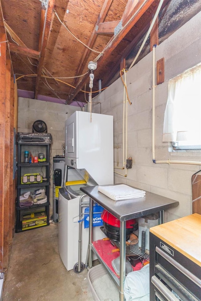 utilities with stacked washer / dryer and electric water heater