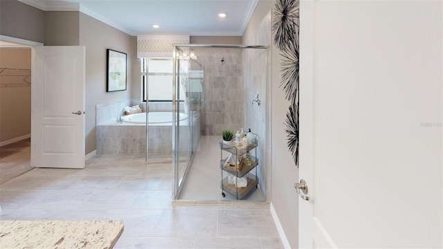 bathroom featuring tile patterned flooring, ornamental molding, and shower with separate bathtub