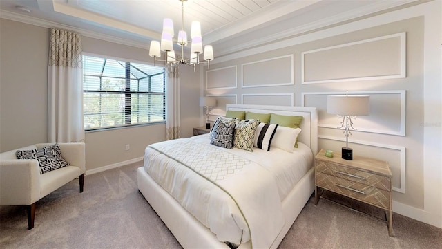 carpeted bedroom with an inviting chandelier, crown molding, and a raised ceiling