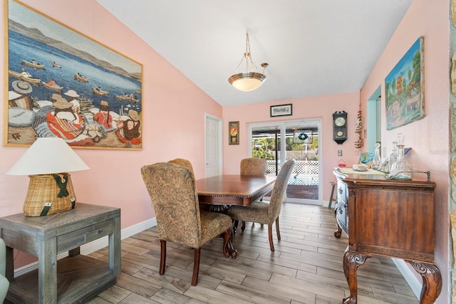 dining room with lofted ceiling