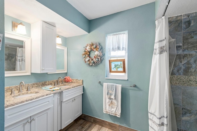 bathroom with vanity and curtained shower