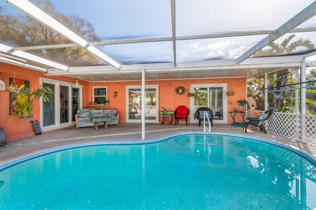 view of pool featuring a patio area and a lanai