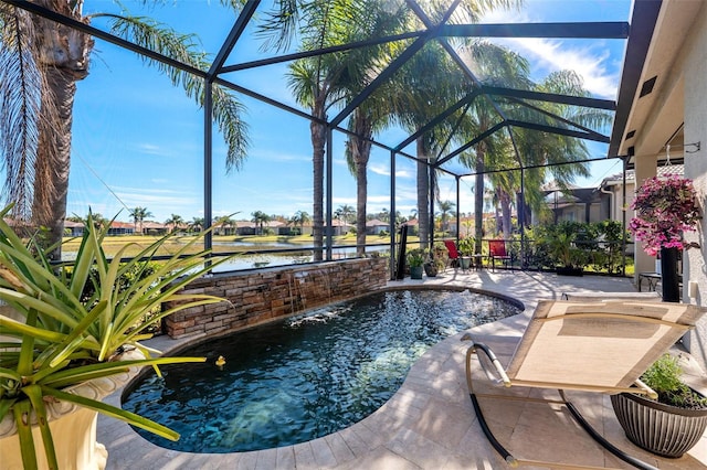 view of pool featuring pool water feature, a patio area, and glass enclosure