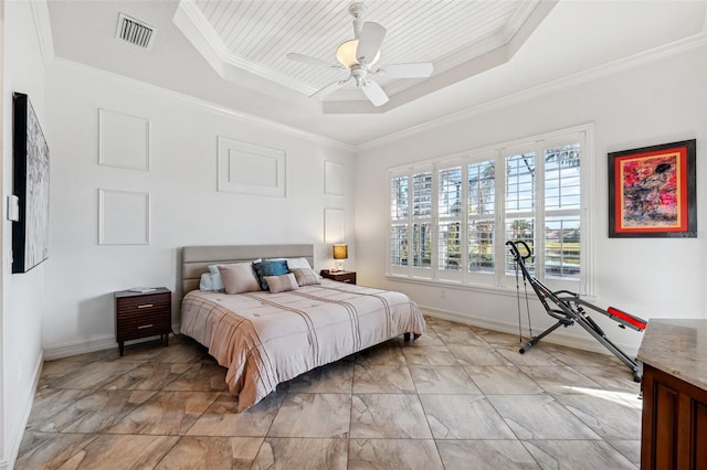 bedroom featuring crown molding, a raised ceiling, and ceiling fan