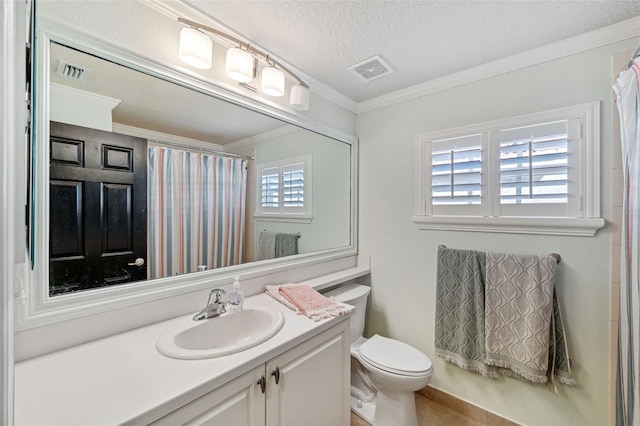 bathroom with ornamental molding, vanity, a textured ceiling, and toilet