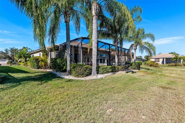 view of property exterior featuring a yard and glass enclosure