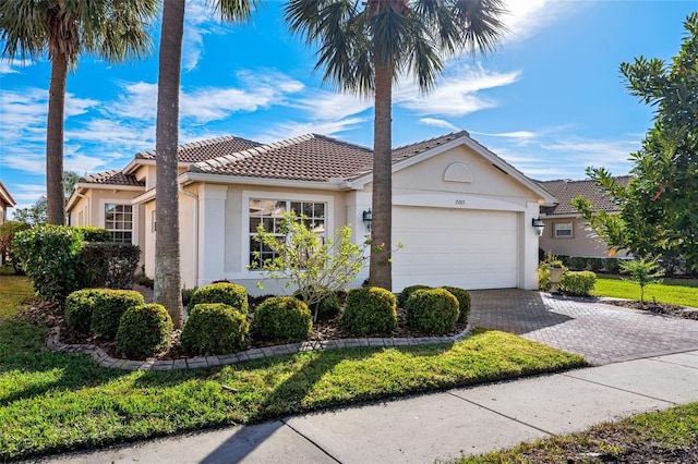 view of front of property with a garage