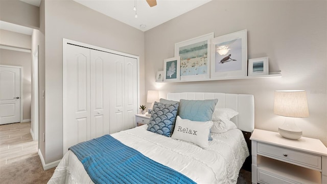 bedroom featuring ceiling fan and a closet