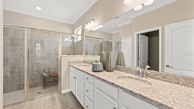 bathroom with walk in shower, ornamental molding, vanity, and tile patterned flooring