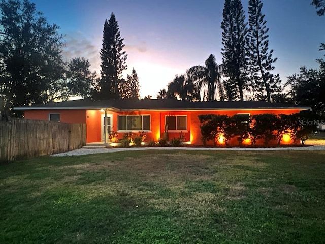 view of front of home with a lawn