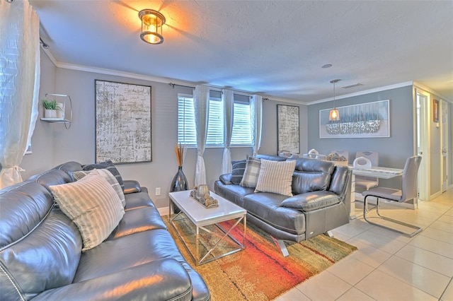 living room featuring ornamental molding, a textured ceiling, and light tile patterned floors