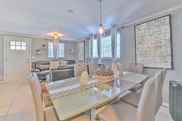 dining space featuring a textured ceiling and light tile patterned flooring