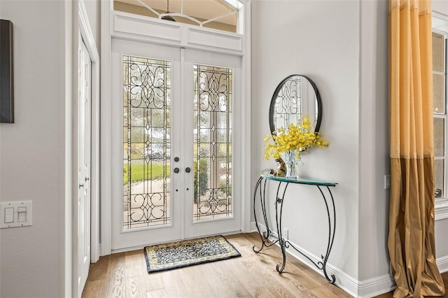 doorway to outside featuring hardwood / wood-style flooring and french doors