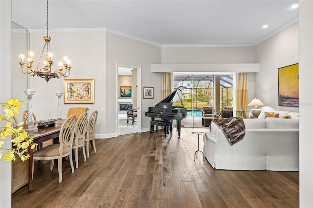 living room with an inviting chandelier, crown molding, and dark wood-type flooring