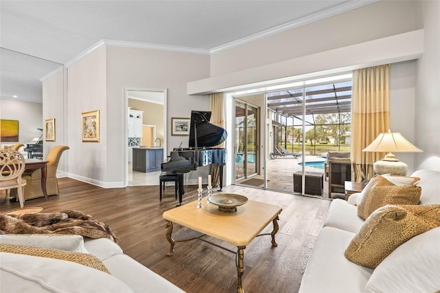 living room with sink, crown molding, and wood-type flooring