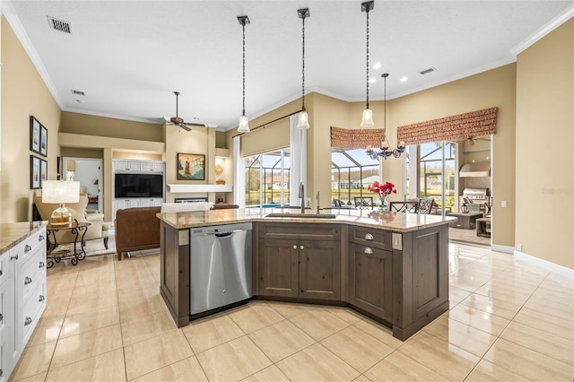 kitchen featuring pendant lighting, light stone counters, stainless steel dishwasher, and white cabinets