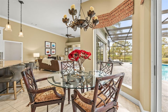 tiled dining space with crown molding, ceiling fan with notable chandelier, and plenty of natural light