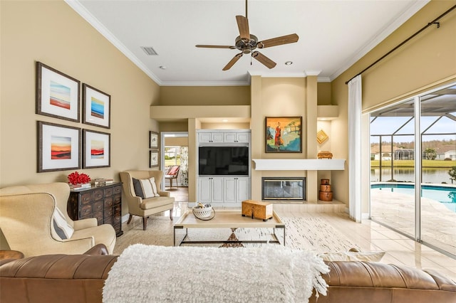 living room featuring crown molding, ceiling fan, plenty of natural light, and built in features