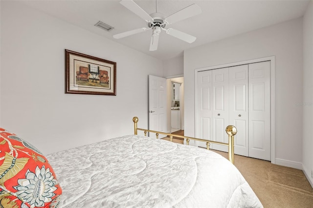 bedroom featuring ceiling fan, carpet floors, and a closet