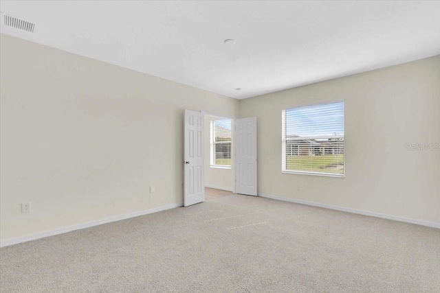 view of carpeted spare room