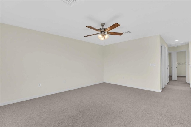 carpeted empty room featuring ceiling fan