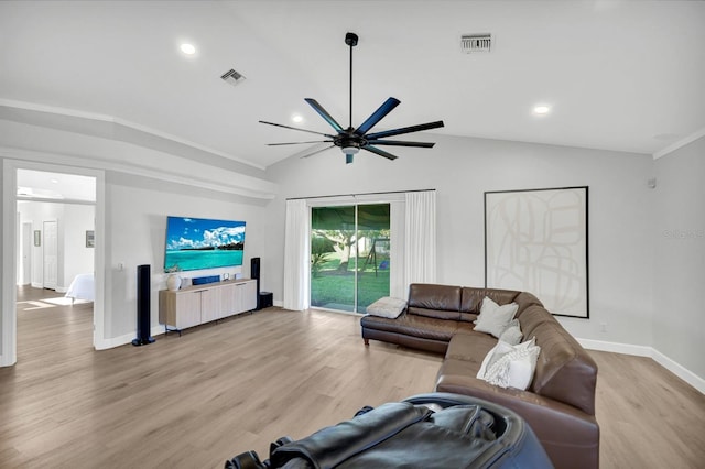 living room with vaulted ceiling, ornamental molding, and light hardwood / wood-style floors