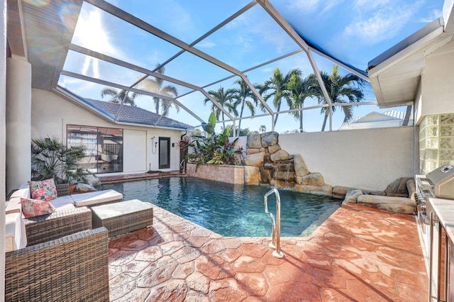 view of pool with pool water feature, an outdoor hangout area, a patio area, and a lanai