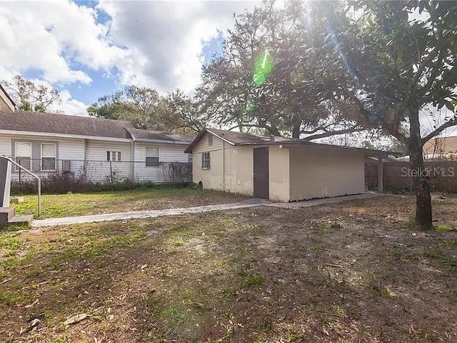 back of property featuring a lawn