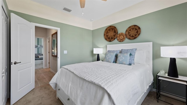 carpeted bedroom with ceiling fan