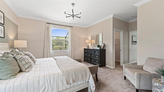 carpeted bedroom featuring ornamental molding, a walk in closet, a chandelier, and a closet