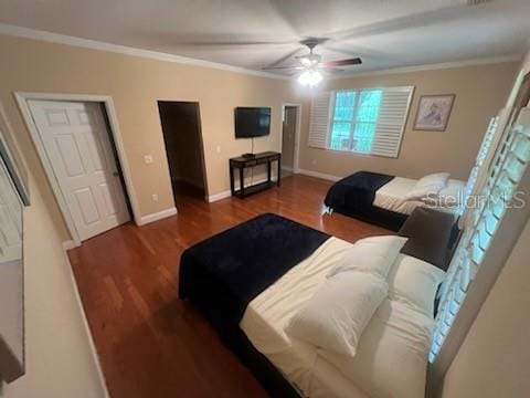 bedroom featuring ceiling fan, dark hardwood / wood-style flooring, and ornamental molding