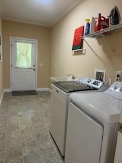 clothes washing area with washing machine and dryer