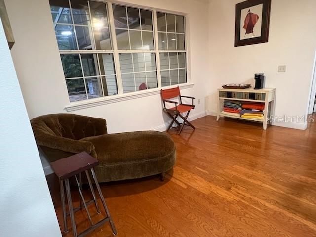 living area with hardwood / wood-style floors