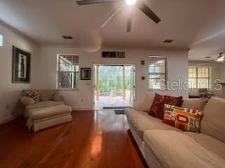 living room featuring ceiling fan and hardwood / wood-style flooring