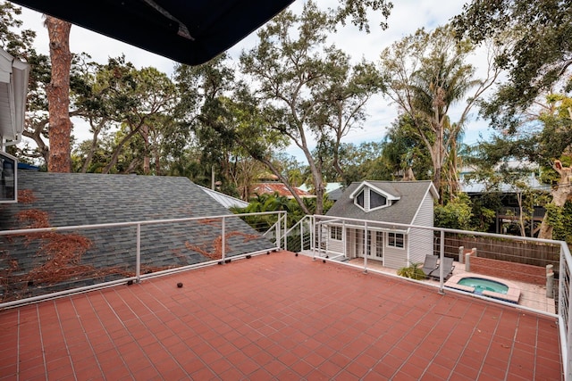 view of patio with an in ground hot tub