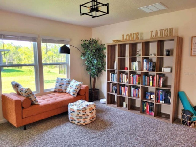 living area with carpet flooring