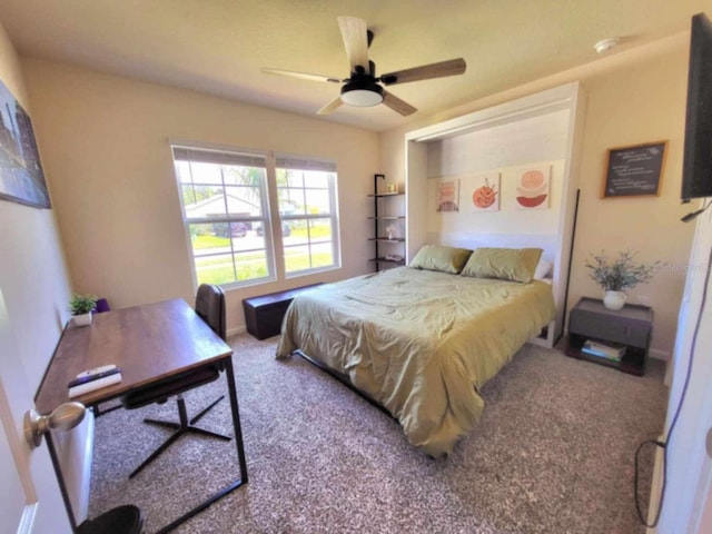 bedroom with ceiling fan and carpet