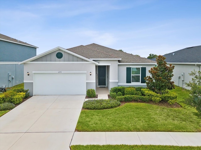 ranch-style home with a front yard and a garage