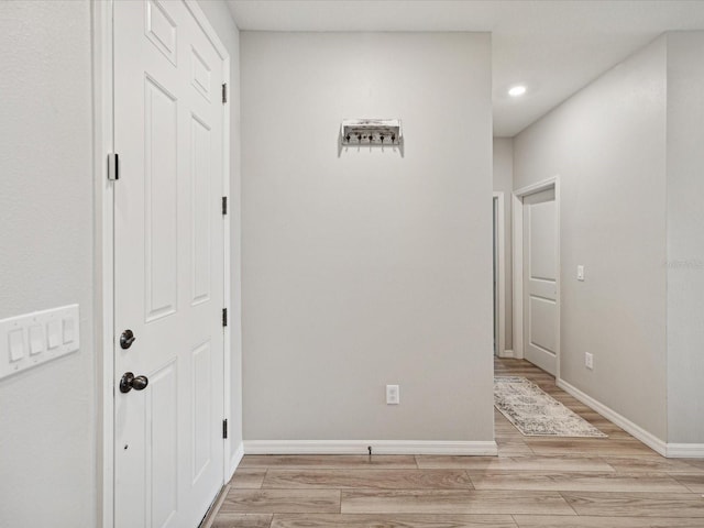 corridor featuring light hardwood / wood-style floors