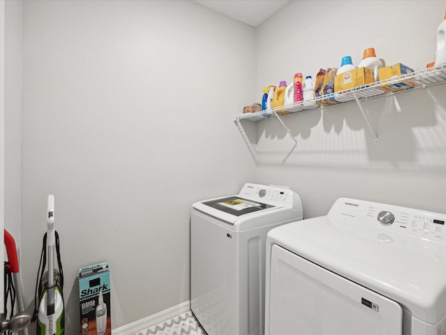 laundry area with washing machine and clothes dryer